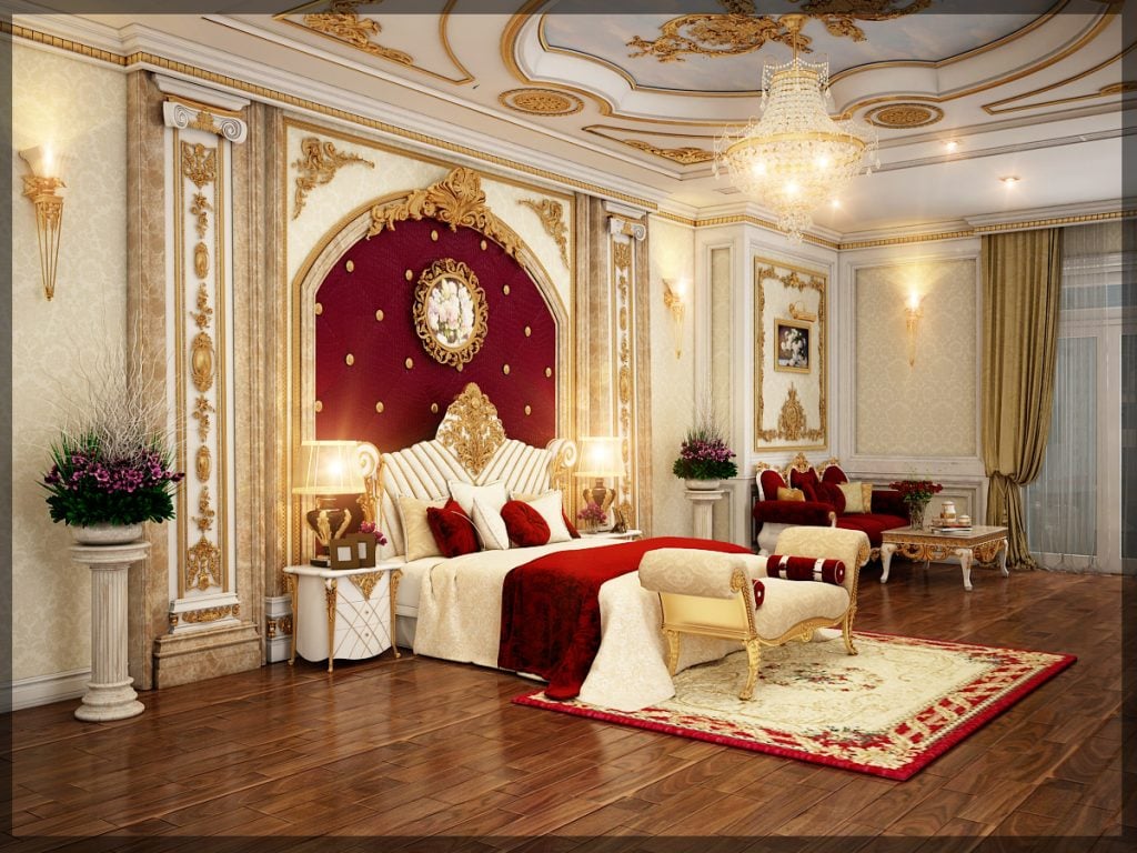 Nội thất phòng ngủ tân cổ điển được thiết kế với đường nét tinh tế, sắc sảo. Nội thất được trang trí bằng các họa tiết mạ vàng, toát lên vẻ đẹp sang trọng và rực rỡ. Điểm nhấn của không gian phòng ngủ là chiếc giường với vách đầu giường bọc nhung gam màu đỏ.