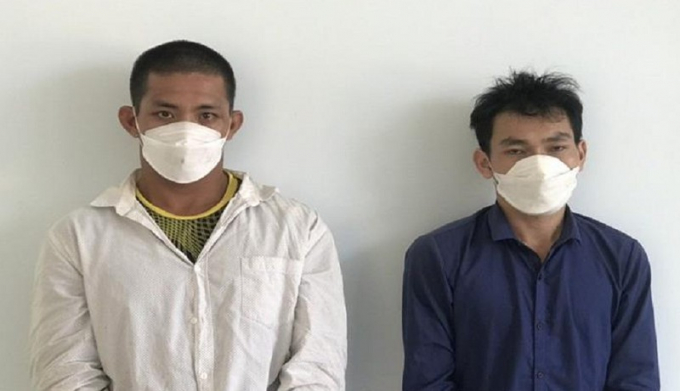 Hai nghi can Nguyễn Hữu Anh và Nguyễn Thái Hòa bị bắt giữ. Ảnh: CA