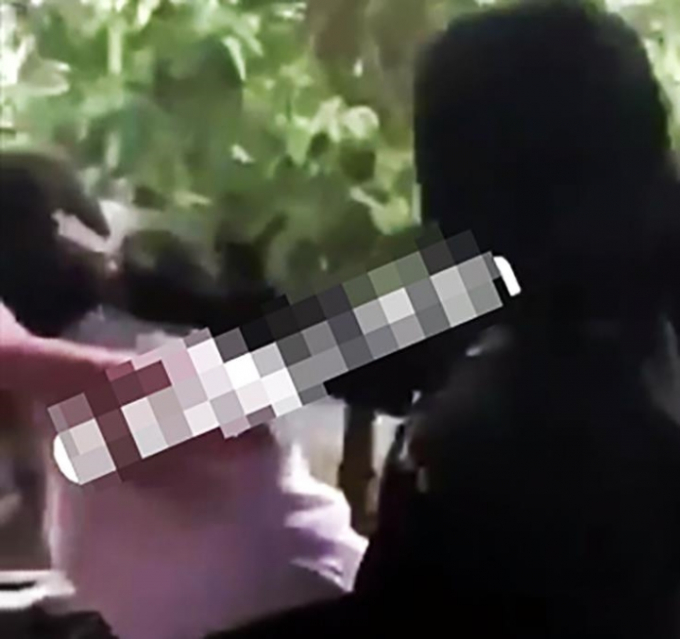 Hình ảnh nữ sinh bị đánh hội đồng lan truyền trên mạng xã hội ở Bình Dương. (Ảnh cắt từ clip)