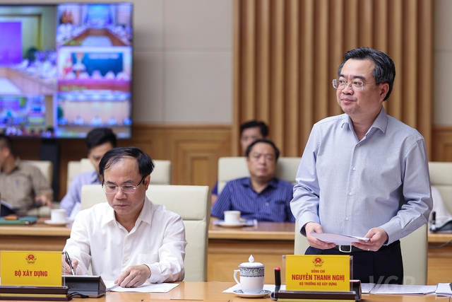 Bộ trưởng Bộ Xây dựng Nguyễn Thanh Nghị trình bày báo cáo đánh giá toàn diện thị trường bất động sản năm 2021 và 6 tháng đầu năm 2022