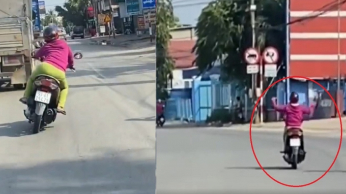 Hình ảnh cắt từ video người phụ nữ lạng lách, buông tay khi điều khiển xe máy.