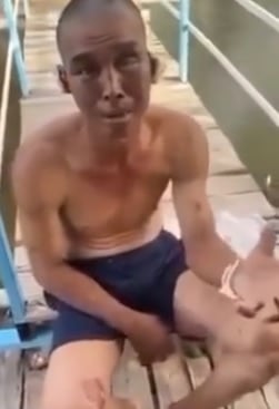 Ông Trung kể lại việc bị hành hạ trên tàu cá. Ảnh cắt từ video.