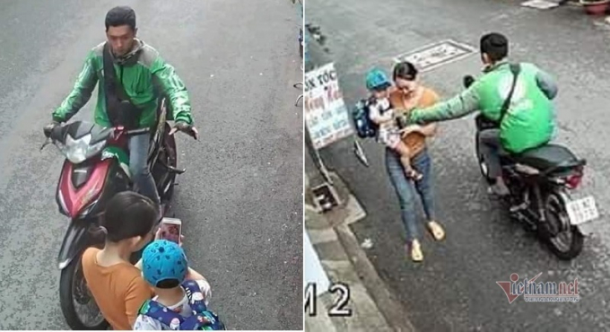 Hình ảnh GrabBike giật điện thoại người phụ nữ bế con nhỏ giữa phố Sài Gòn