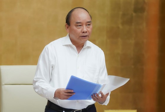 Thủ tướng cho rằng mở cửa trở lại trong trạng thái bình thường mới nhưng không để dịch bệnh lây lan. Ảnh: QUANG PHÚC