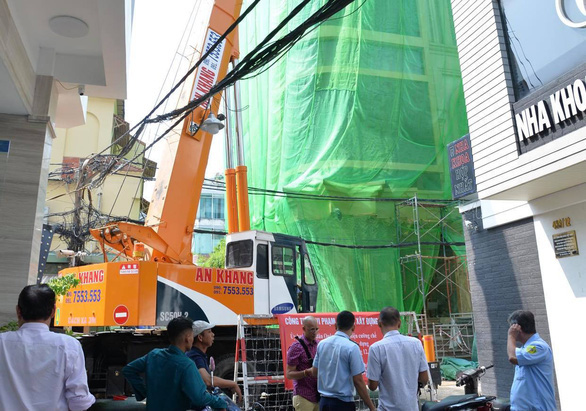 Cưỡng chế tháo dỡ nhà số 433/11 đường Sư Vạn Hạnh (quận 10) - Ảnh: TỰ TRUNG
