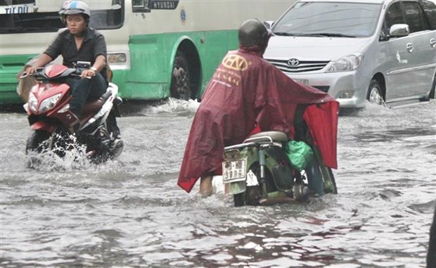 Một tuyến đường tại TP Hồ Chí Minh bị ngập nước sau mưa lớn, tháng 5/2021. Ảnh: TTXVN