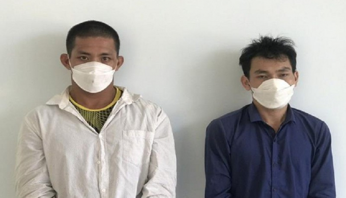 Hai nghi can Nguyễn Hữu Anh và Nguyễn Thái Hòa bị bắt giữ. Ảnh: CA